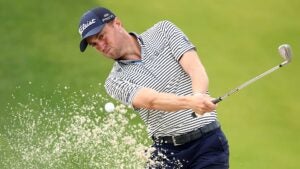 justin thomas hits out of a bunker during a pga championship practice round