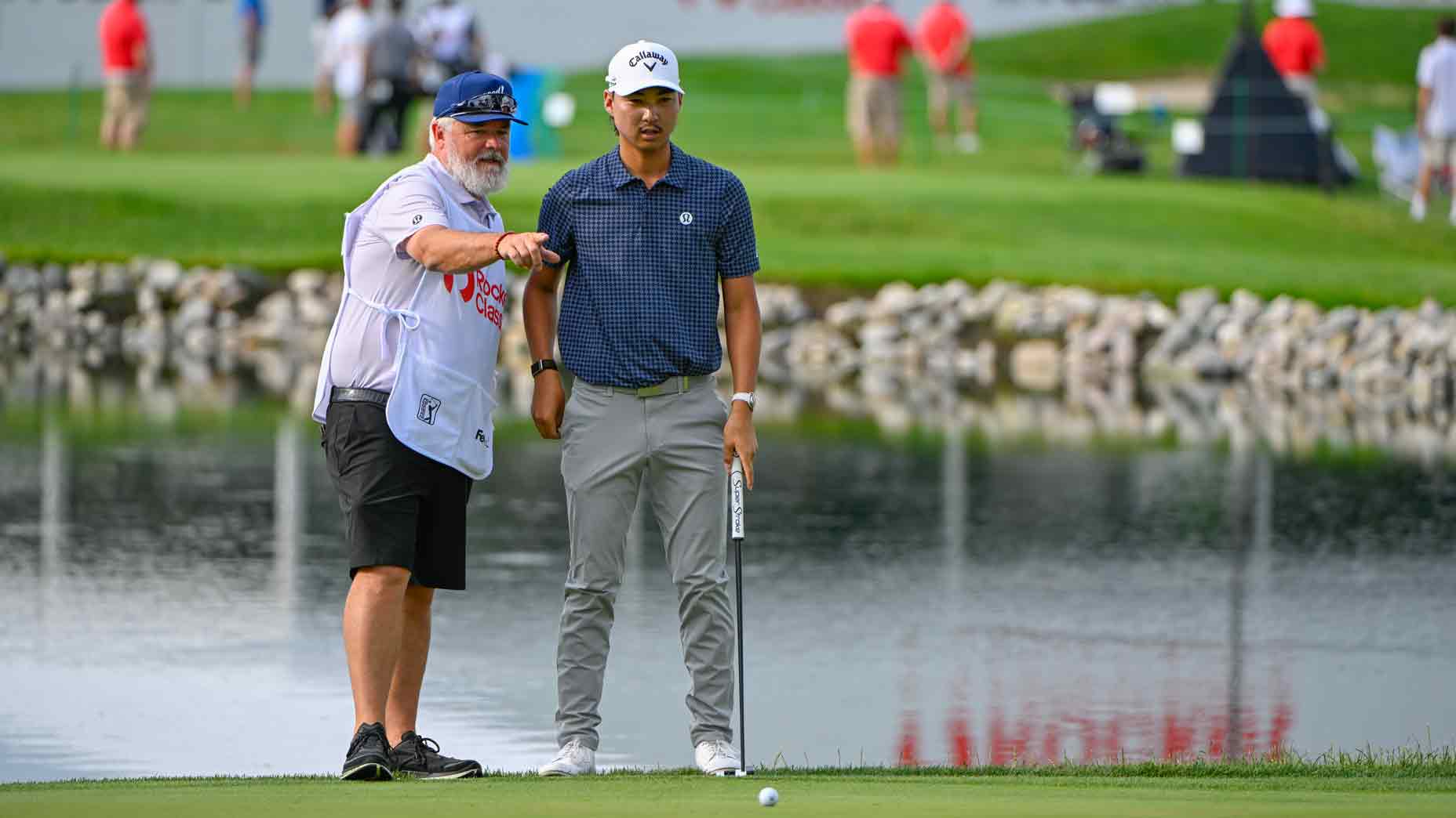 Min Woo Lee (AUS) looks over his eagle putt on 14 during the first round of the Rocket Classic at Detroit Golf Club on June 26, 2025, in Detroit, Michigan.