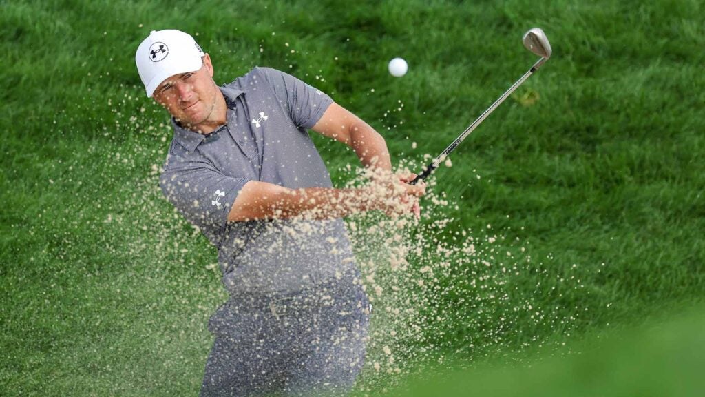 Jordan Spieth blasts out of a bunker during a practice round prior to the 2025 U.S. Open at Oakmont Country Club.