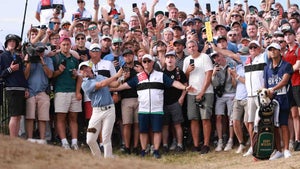 Rory McIlroy hits a shot from the gallery during the 2025 Open Championship