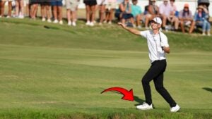 Justin Rose regains his balance after hitting a shot.