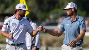 Sam Burns and Cameron Young bump fists at the 2023 WGC Dell Technologies Match Play Championship