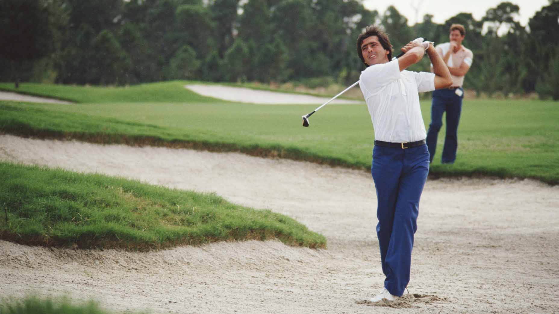 Seve Ballesteros hits a fairway bunker shot during 1983 Ryder Cup at PGA National