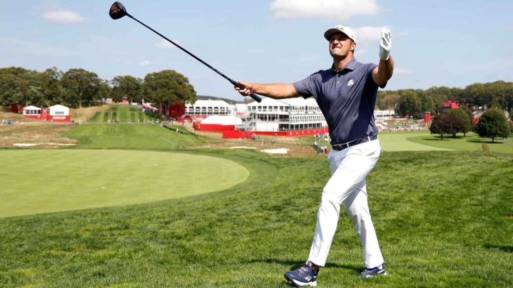 Bryson DeChambeau of Team United States acknowledges the crowd while playing the 18th hole prior to the Ryder Cup 2025
