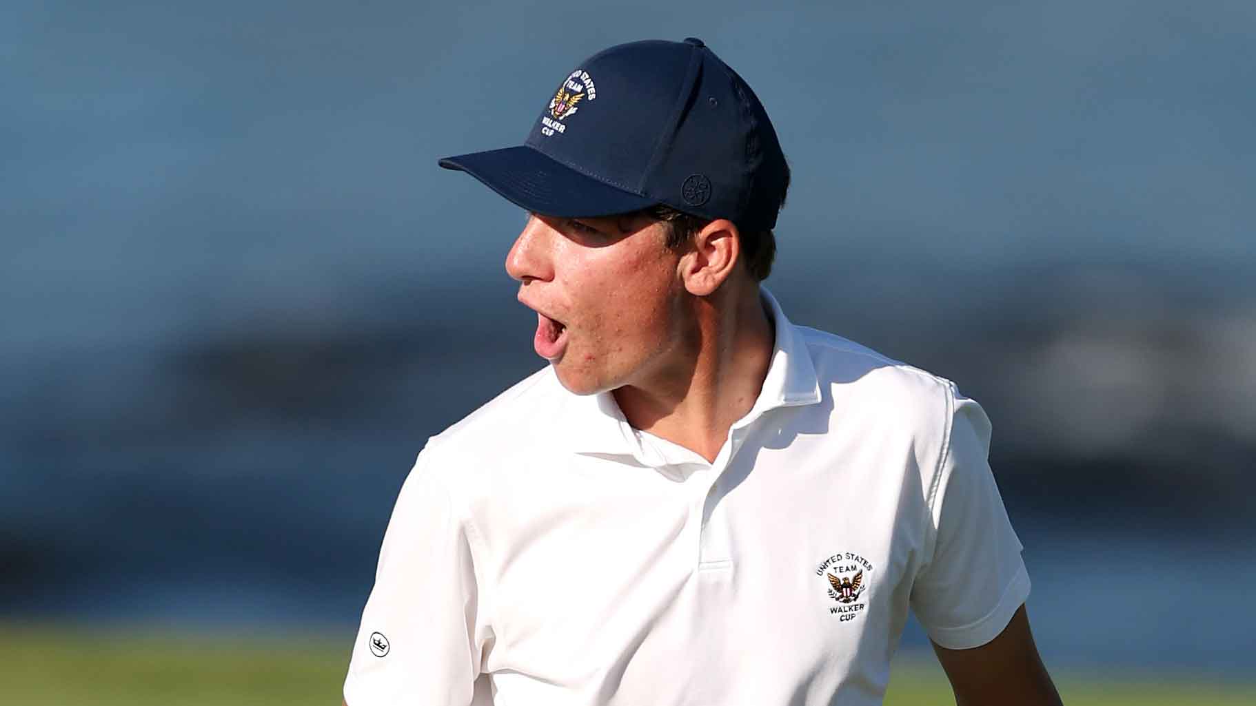 Mason Howell of Team United States reacts after sinking a putt to defeat Luke Poulter of Team Great Britain and Ireland in Saturday singles on the 16th green during Day One of The 50th Walker Cu