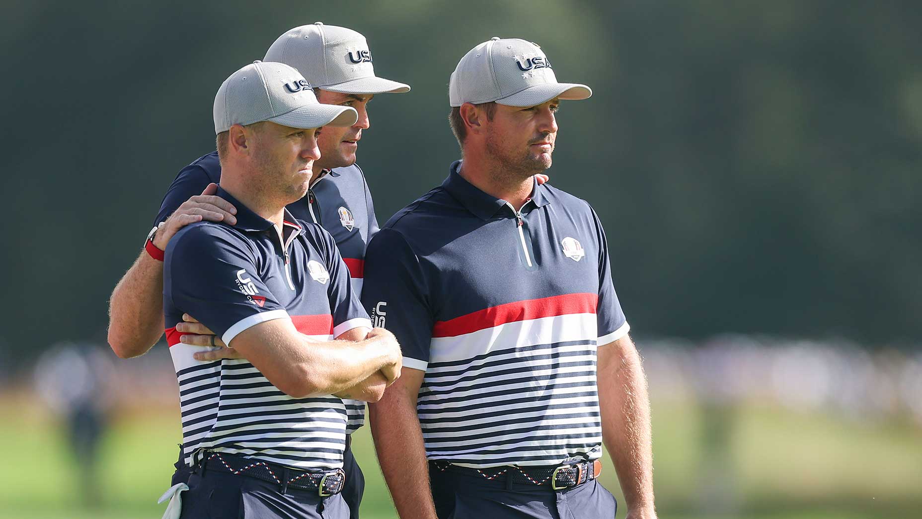 Keegan Bradley, Justin Thomas and Bryson DeChambeau look on during the opening day of the Ryder Cup on Friday at Bethpage Black.