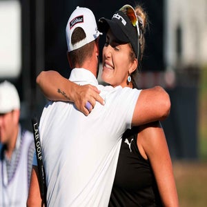 Teammates Lexi Thompson of the United States and Wyndham Clark of the United States hug on the 18th hole green after finishing the first round of the Grant Thornton Invitational 2025 at Tiburon Golf Club on December 12, 2025 in Naples, Florida. (Photo by Sam Navarro/Getty Images)