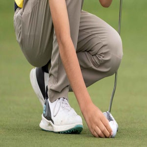 Dashiell White of Boys 10-11 group lines up a putt on the No. 18 green during the Drive, Chip and Putt National Finals at Augusta National Golf Club,