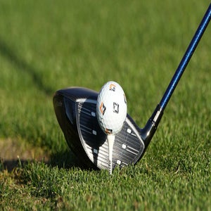 Qi4D Driver behind the golf ball.