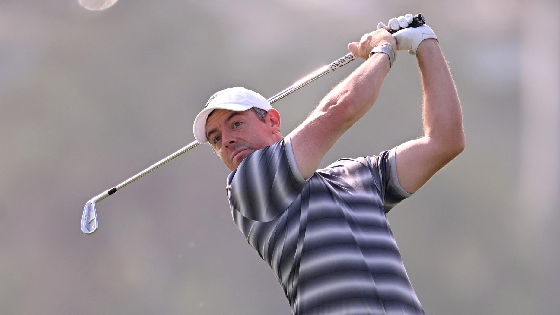 Rory McIlroy of Northern Ireland plays his second shot on the 13th hole on day one of the Dubai Invitational 2026 at Dubai Creek Resort on January 15, 2026 in Dubai, United Arab Emirates. (Photo by Ross Kinnaird/Getty Images)