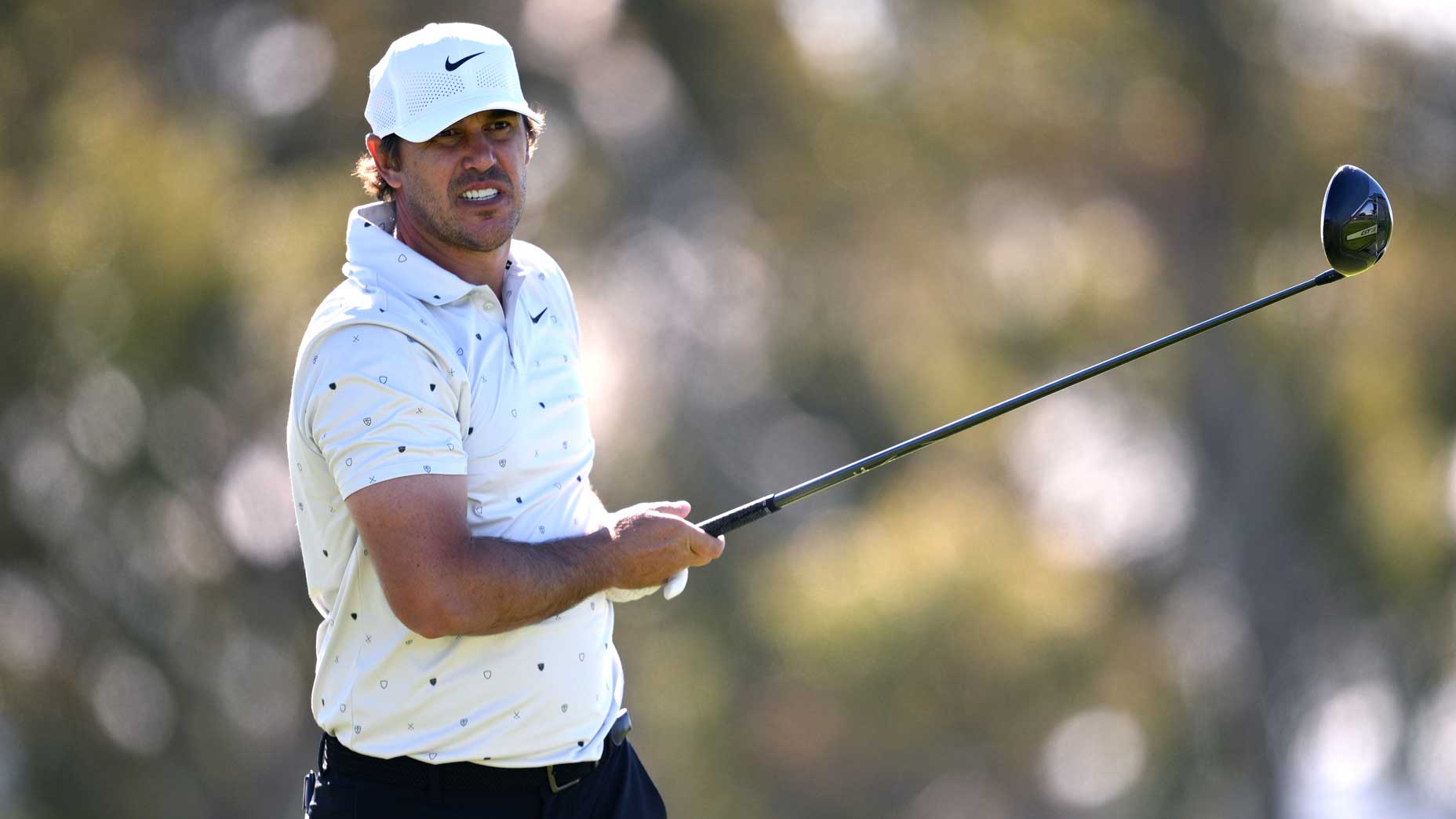 Brooks Koepka hits shot during 2026 Farmers Insurance Open at Torrey Pines.