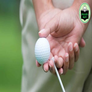 golfer holding unmarked golf ball
