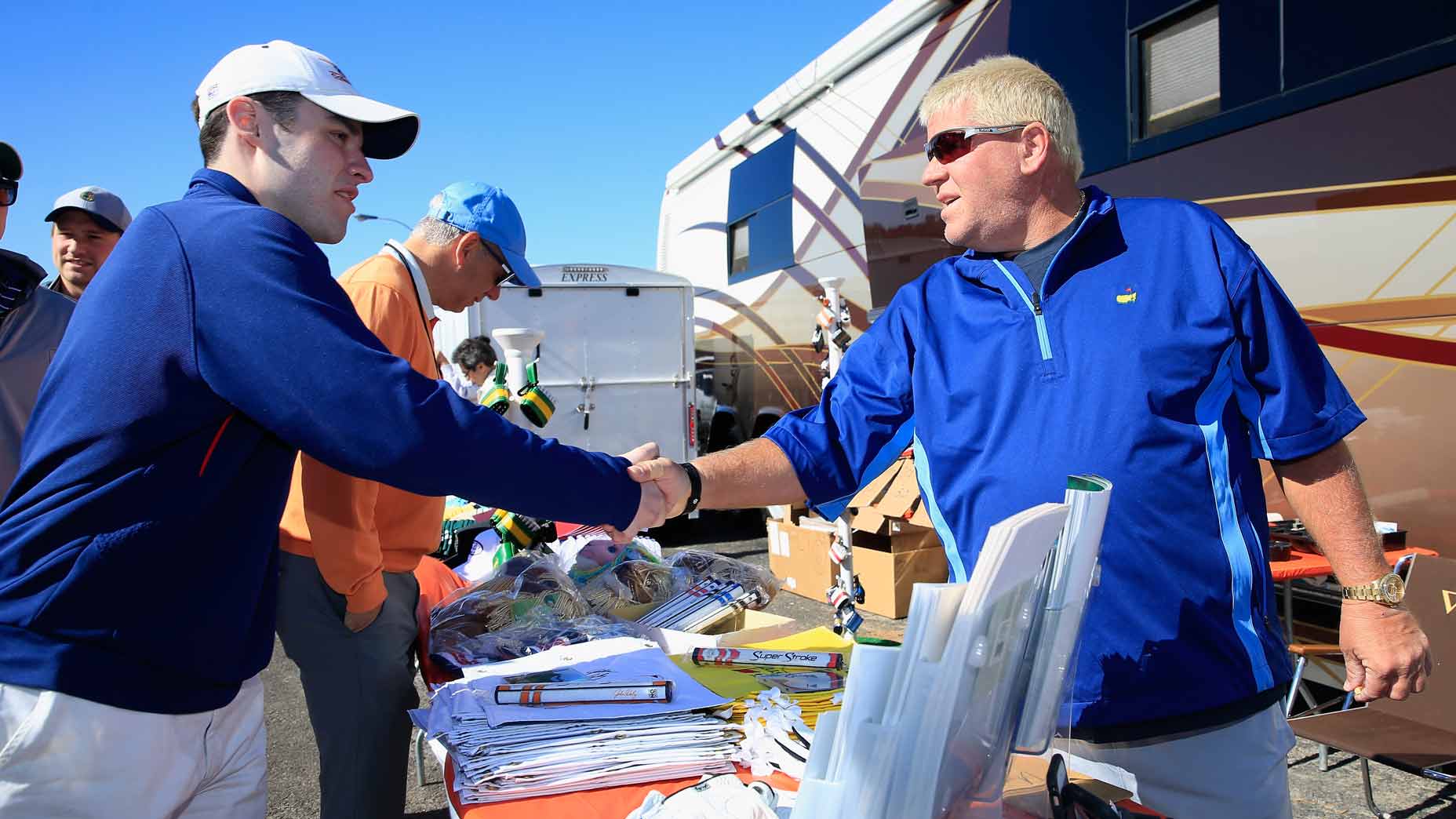 John Daly greets a fan at Augusta's Hooters during Masters week in 2016.