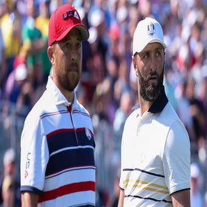 Jon Rahm and Xander Schauffele look on during the 2025 Ryder Cup