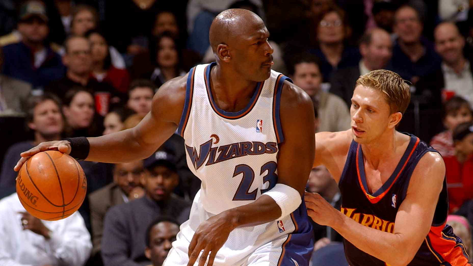 Michael Jordan handles the ball against Bob Sura