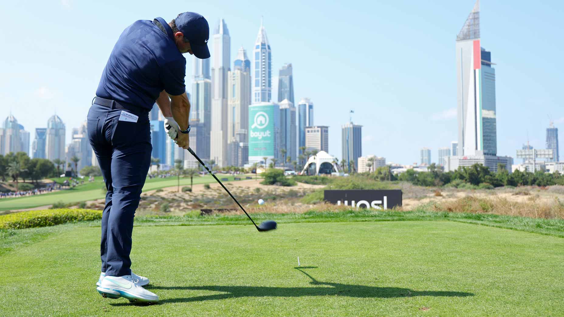 rory mcilroy hits a drvie during the 2023 dubai desert classic