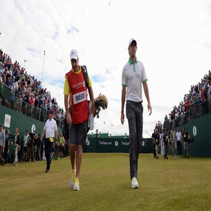 Rory McIlroy walks off the 1st tee at Muirfield during the 2013 Open Championship.
