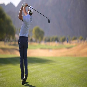 Scottie Scheffler of the United States plays his shot from the 15th tee during the final round of The American Express 2026 at Pete Dye Stadium Course
