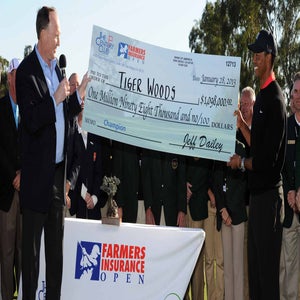 Tiger Woods presented with the winner's check at 2013 Farmers Insurance Open at Torrey Pines.