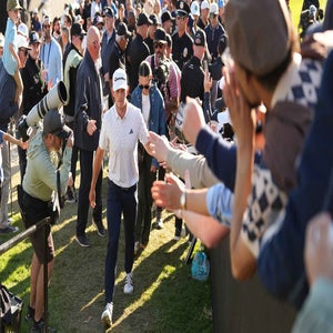 Jacob Bridgeman high fives fans while walking up the stairs towards the clubhouse during the third round of The Genesis Invitational at The Riviera Country Club on February 21, 2026 in Pacific Palisades, California. (Photo by Ben Jared/PGA TOUR via Getty Images)