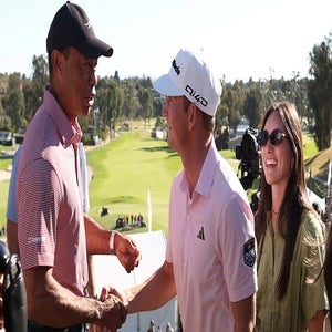 Tiger Woods, Jacob Bridgeman and a well-earned handshake.