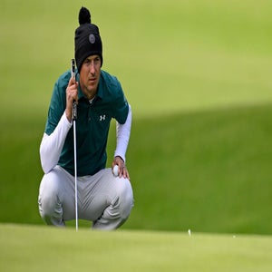 Jordan Spieth lines up a putt at the Genesis Invitational