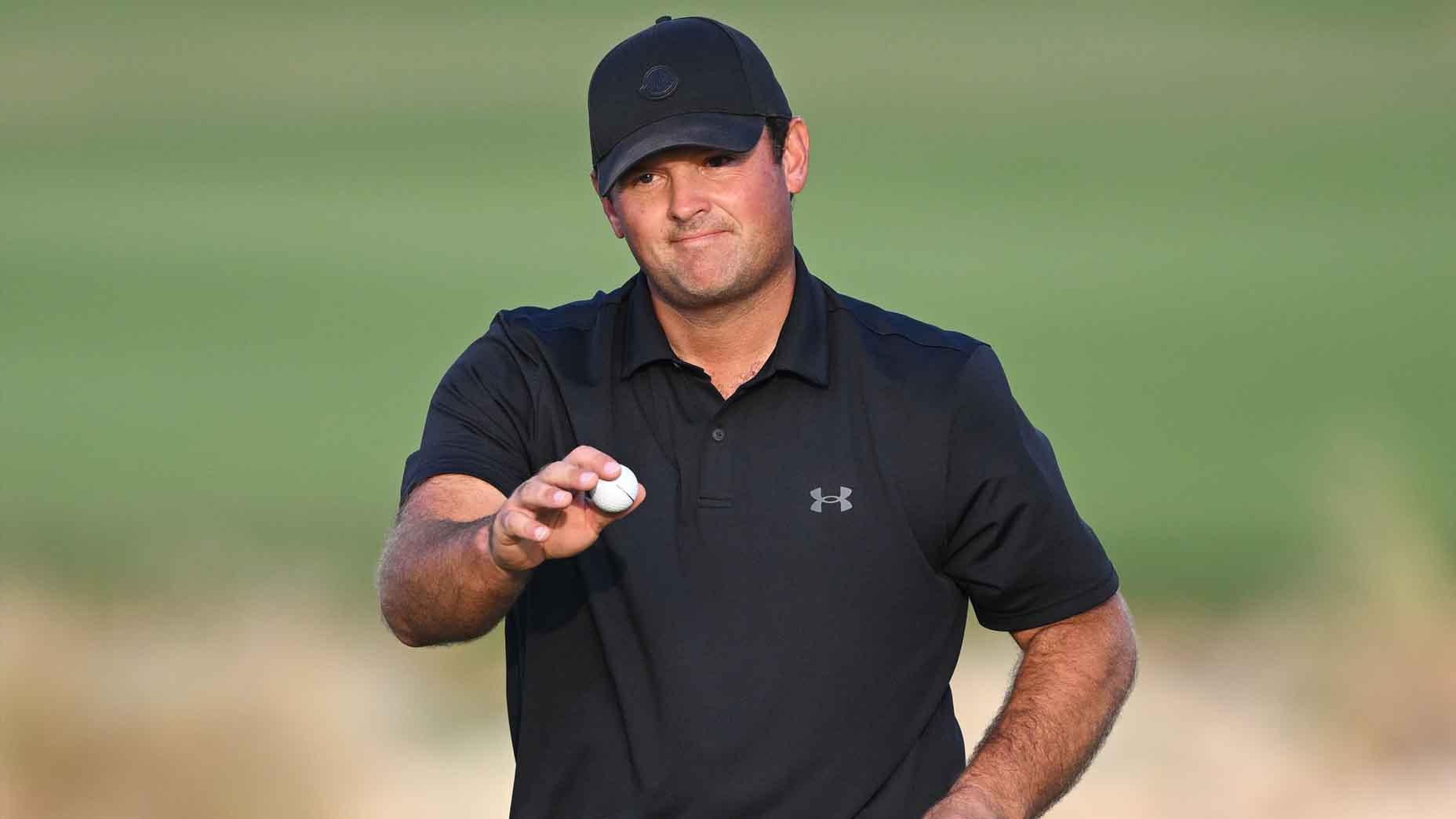 Patrick Reed acknowledges the crowd at the Qatar Masters