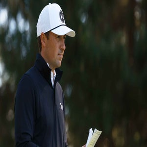jordan spieth stands with scorecard at AT&T Pebble Beach Pro-Am.