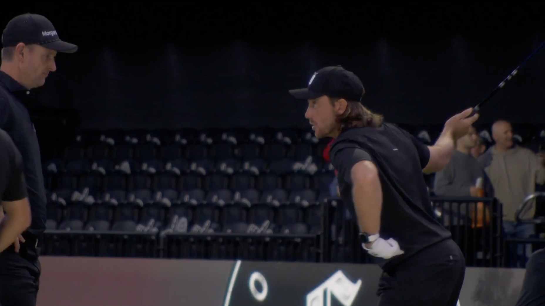 tommy fleetwood talks to justin rose during tgl match