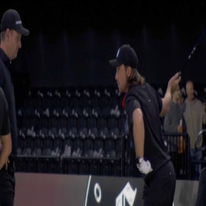 tommy fleetwood talks to justin rose during tgl match
