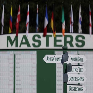 2026 Masters dates: A view of course signage by a scoreboard at Augusta National.