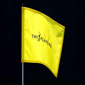 2026 Players Championship flag blows in the wind at TPC Sawgrass' Stadium Course.