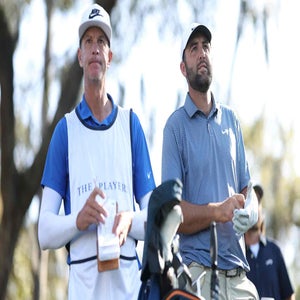 Scottie Scheffler of the United States prepares to play a shot from the 12th tee alongside caddie Ted Scott during the second round of THE PLAYERS Championship 2026 at THE PLAYERS Stadium course at TPC Sawgrass on March 13, 2026 in Ponte Vedra Beach, Florida. (Photo by Richard Heathcote/Getty Images)