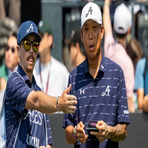 Anthony Kim taks to caddie during the 2026 LIV Golf Hong Kong event on Thursday.
