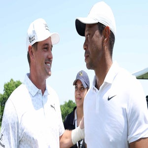 Bryson DeChambeau talks with Tiger Woods before the 2022 PGA Championship at Southern Hills.