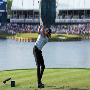 cameron young swings tee shot on the 17th green at TPC Sawgrass