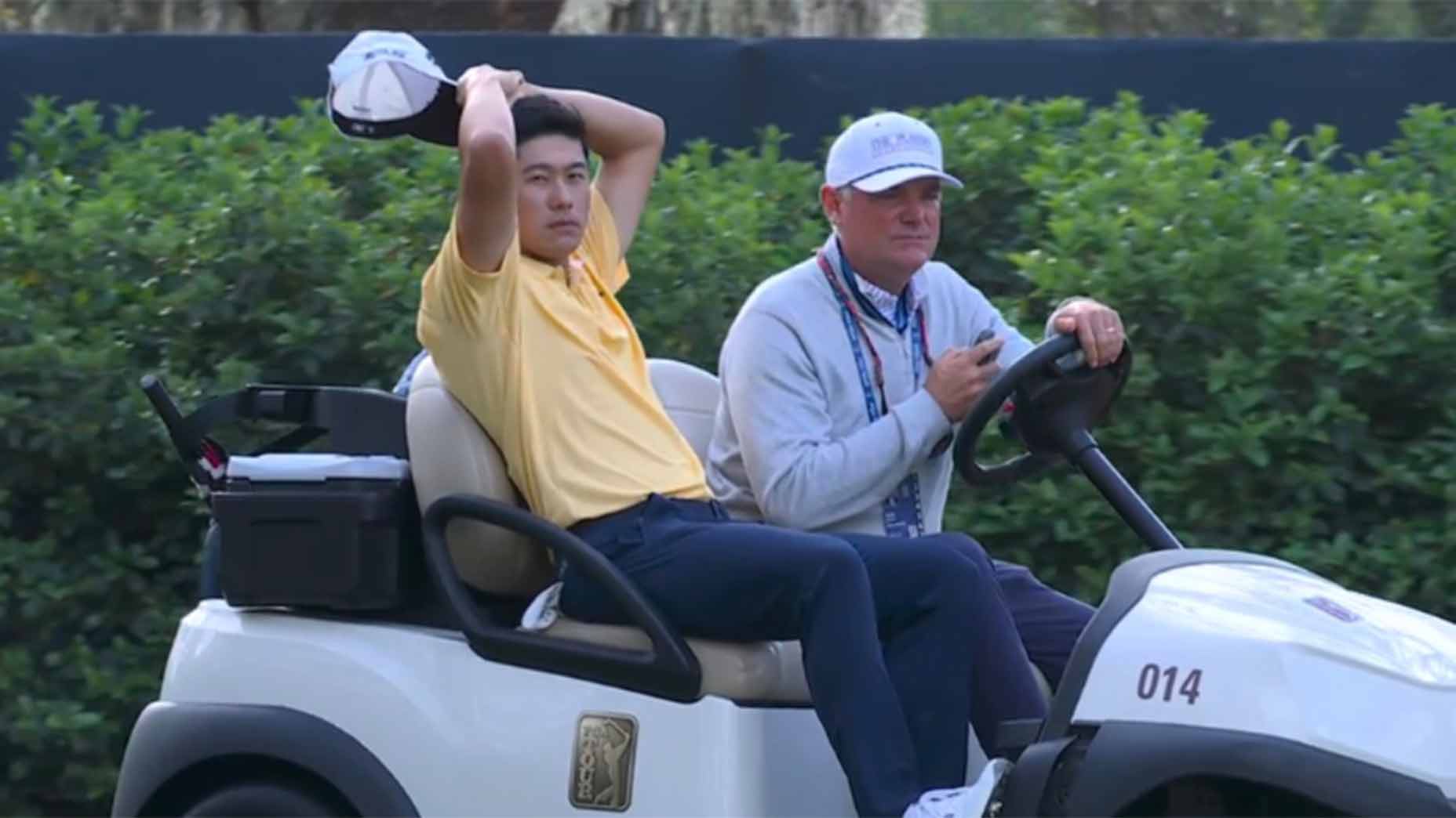 collin morikawa on a cart