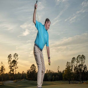 dom dijulia demonstrates finding the "slot" of your backswing with a training aid