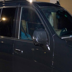 tiger woods sits in car after DUI arrest in South Florida.