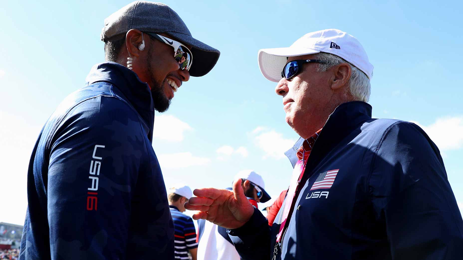 PGA Tour veterans Tiger Woods and Curtis Strange talk during the 2016 Ryder Cup.