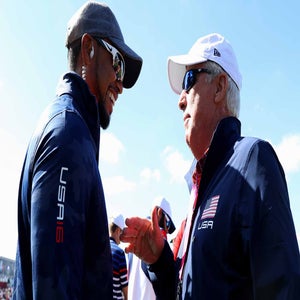 PGA Tour veterans Tiger Woods and Curtis Strange talk during the 2016 Ryder Cup.