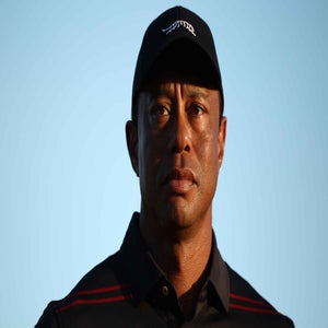 Tiger Woods of the United States stands on the 18th green for the trophy ceremony during the final round of the Hero World Challenge 2025 at Albany Golf Course