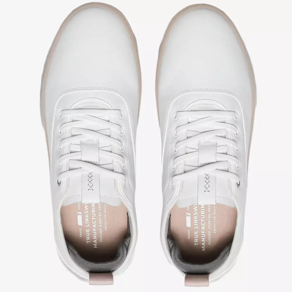 Top view of a pair of white lace-up sneakers with text on the insoles, featuring clean design lines and a beige pull tab&mdash;perfect for anyone seeking the best women's golf shoes 2026 with style and comfort.