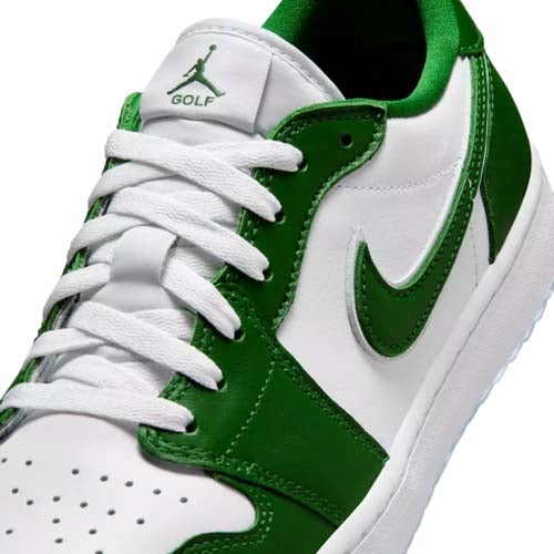 Close-up of one of the best Jordan golf shoes: a white and green Nike golf shoe with white laces, perforated toe box, green Nike swoosh, and GOLF text beneath the Jumpman logo on the tongue.