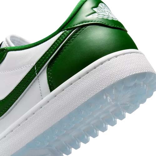Close-up of the heel of a white and green sneaker, one of the best Jordan golf shoes, featuring a translucent textured sole and the Air Jordan Wings logo on the green heel tab.