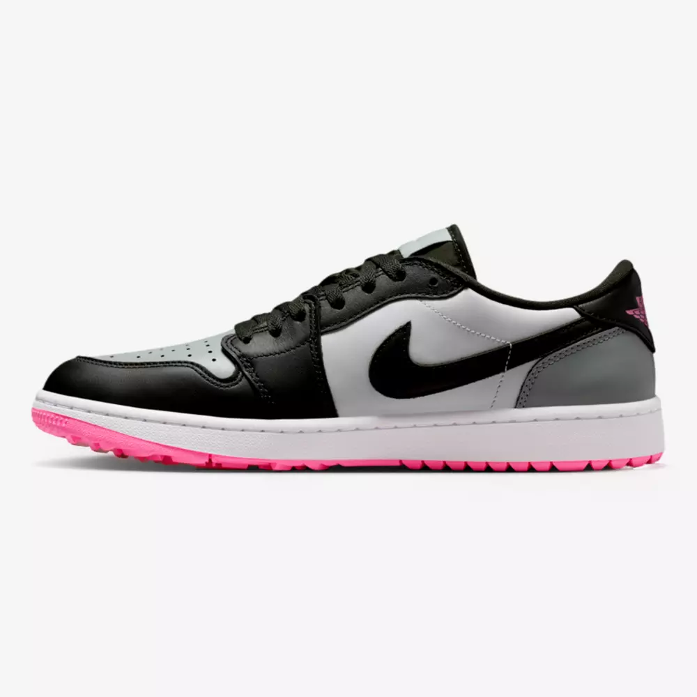 A low-top sneaker with a black, white, and gray leather upper, black laces and swoosh, a white midsole, and a pink outsole&mdash;turning heads like the best Jordan golf shoes on the course.