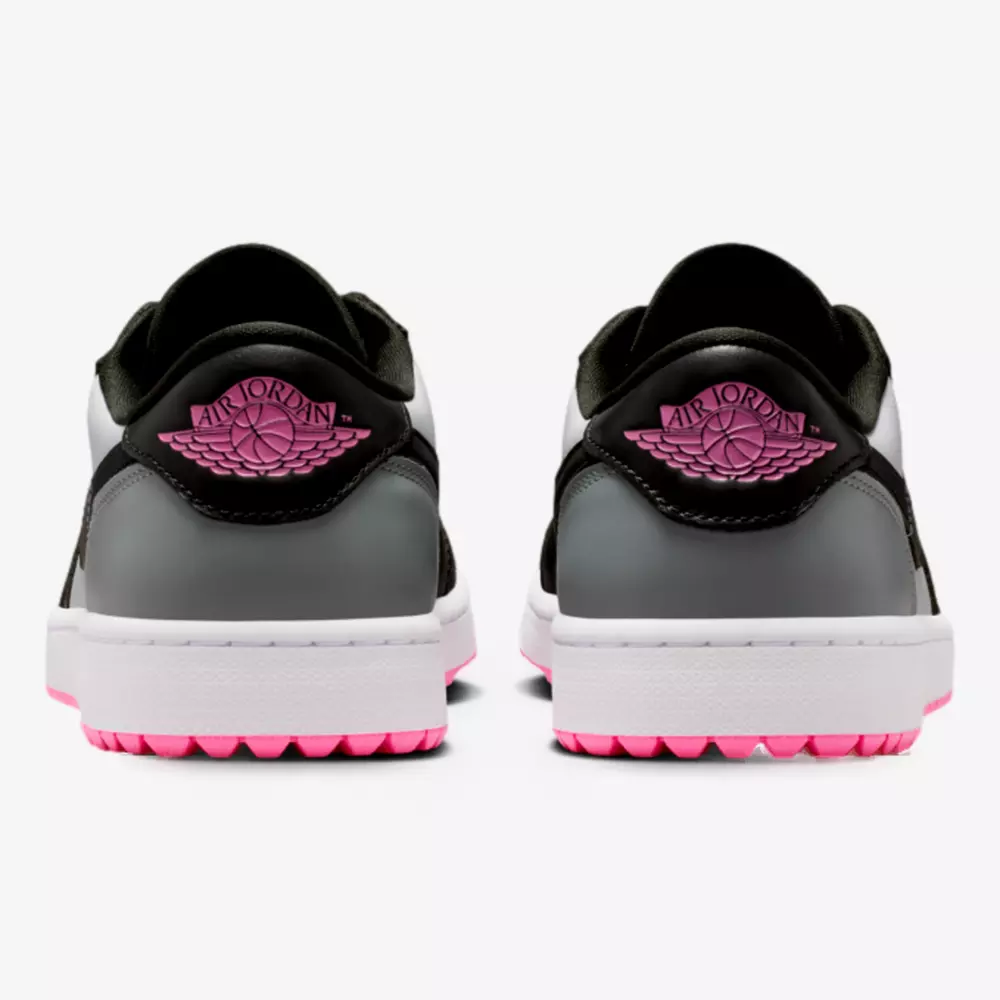 Rear view of two Air Jordan sneakers in black, white, and gray with pink rubber soles and pink Air Jordan logo on the heels&mdash;showcasing a style inspired by the best Jordan golf shoes, displayed against a white background.