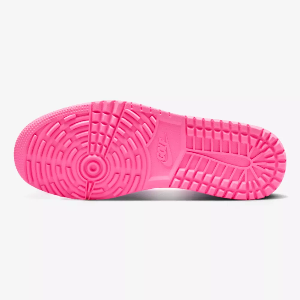 A bright pink sneaker outsole is displayed against a white background, featuring a circular tread pattern and textured details for grip&mdash;reminiscent of the traction found on the best Jordan golf shoes.