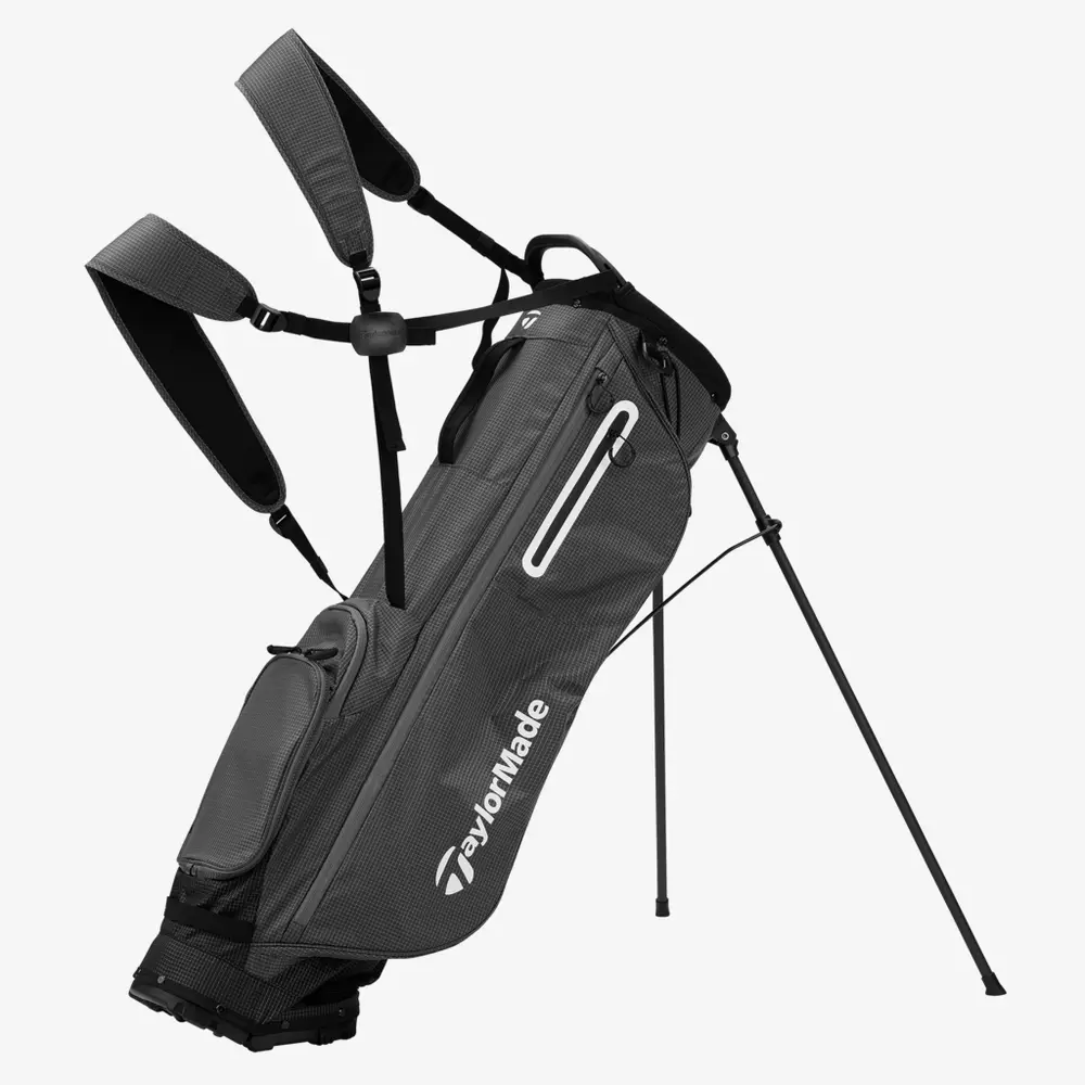 A gray TaylorMade golf stand bag with dual shoulder straps, zippered pockets, and extended legs to keep the bag upright&mdash;an ideal choice for anyone seeking one of the best golf bags 2026 has to offer.