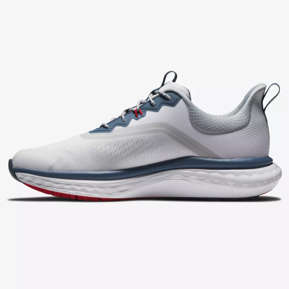A white athletic running shoe with gray, blue, and red accents, featuring a textured sole, mesh upper, and lace-up design&mdash;styled for versatility to rival the best golf shoes 2026&mdash;in a side profile view on a plain background.